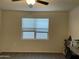 Bright bedroom featuring a double window with blinds at 35262 W San Ildefanso Ave, Maricopa, AZ 85138