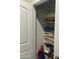 Shelved closet with folded clothes and Spider-Personal toy at 35262 W San Ildefanso Ave, Maricopa, AZ 85138