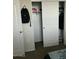 Bedroom closet with hanging clothes and shelving at 35262 W San Ildefanso Ave, Maricopa, AZ 85138