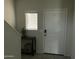 Front entry with keyless entry and small console table at 35262 W San Ildefanso Ave, Maricopa, AZ 85138