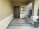 Small front porch with seating for two at 35262 W San Ildefanso Ave, Maricopa, AZ 85138