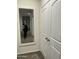 Bright hallway with mirror and double door closet at 35262 W San Ildefanso Ave, Maricopa, AZ 85138