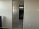 Hallway with door and closet access at 35262 W San Ildefanso Ave, Maricopa, AZ 85138