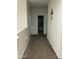 Upper hallway with carpet, leading to bathroom and bedrooms at 35262 W San Ildefanso Ave, Maricopa, AZ 85138