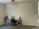 Bright home office features a desk, chair, and ample wall space at 35262 W San Ildefanso Ave, Maricopa, AZ 85138