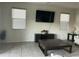 Bright living room featuring a large TV and comfortable seating at 35262 W San Ildefanso Ave, Maricopa, AZ 85138
