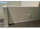 Stairwell with neutral colored walls and carpeted stairs at 35262 W San Ildefanso Ave, Maricopa, AZ 85138