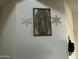 Wall with religious artwork and snowflakes at 35262 W San Ildefanso Ave, Maricopa, AZ 85138