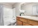 Clean bathroom featuring a shower and tub combo, granite countertops, and a stylish mirror and decor at 3830 E Lakewood E Pkwy # 2154, Phoenix, AZ 85048