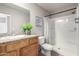 A clean bathroom featuring a shower, granite countertops, a mirror, and decor at 3830 E Lakewood E Pkwy # 2154, Phoenix, AZ 85048