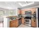 Kitchen features stainless steel appliances, granite counters, and light wood cabinetry at 3830 E Lakewood E Pkwy # 2154, Phoenix, AZ 85048