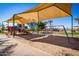 Community playground with swings and shade structures at 3830 E Lakewood E Pkwy # 2154, Phoenix, AZ 85048