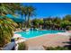 Sparkling community pool and surrounding patio area at 3830 E Lakewood E Pkwy # 2154, Phoenix, AZ 85048