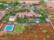 Aerial view of expansive estate, showcasing pool, sports court, and lush landscaping at 4090 E Galvin St, Cave Creek, AZ 85331