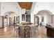 Wet bar with granite countertop and stone accents; perfect for entertaining at 4090 E Galvin St, Cave Creek, AZ 85331