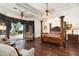 Luxurious main bedroom with a large four-poster bed and sitting area at 4090 E Galvin St, Cave Creek, AZ 85331