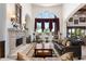 Spacious living room with a fireplace and large windows at 4090 E Galvin St, Cave Creek, AZ 85331