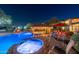 Night view of the pool, spa, and outdoor entertaining area at 4090 E Galvin St, Cave Creek, AZ 85331