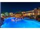Stunning nighttime view of the pool and spa area at 4090 E Galvin St, Cave Creek, AZ 85331
