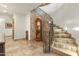 Elegant staircase with ornate railing and grand clock at 4090 E Galvin St, Cave Creek, AZ 85331