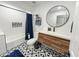 Modern bathroom with a soaking tub, double vanity, and patterned tile floor at 4121 W Alta Vista Rd, Phoenix, AZ 85041