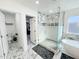 Elegant bathroom with a freestanding tub, walk-in shower, and marble accents at 4121 W Alta Vista Rd, Phoenix, AZ 85041
