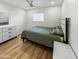Bedroom with green bedding and white dresser at 4121 W Alta Vista Rd, Phoenix, AZ 85041