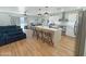 Modern kitchen with white cabinets, large island, and stainless steel appliances at 4121 W Alta Vista Rd, Phoenix, AZ 85041