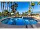 Community pool and spa with surrounding patio furniture at 5124 N 31St Pl # 523, Phoenix, AZ 85016