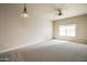 Large bedroom with ceiling fan and neutral wall colors at 5450 E Deer Valley Dr # 4201, Phoenix, AZ 85054