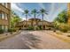 Elegant building exterior with palm trees and a grand entrance at 5450 E Deer Valley Dr # 4201, Phoenix, AZ 85054