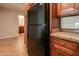 Kitchen area with black refrigerator and granite countertop at 5450 E Deer Valley Dr # 4201, Phoenix, AZ 85054