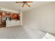 Spacious living room with ceiling fan and neutral carpeting at 5450 E Deer Valley Dr # 4201, Phoenix, AZ 85054