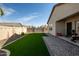 Artificial turf backyard with covered patio and workout area at 5922 E Athena Rd, Florence, AZ 85132