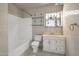 Updated bathroom with white vanity and tiled shower/tub at 6249 S Parkside Dr, Tempe, AZ 85283