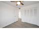 Bright bedroom with wood-look tile flooring and ceiling fan at 6249 S Parkside Dr, Tempe, AZ 85283