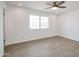 Well lit bedroom with wood-look tile flooring and ceiling fan at 6249 S Parkside Dr, Tempe, AZ 85283