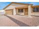 Front view of the house showcasing a tan stucco exterior, a garage, and an entryway at 6249 S Parkside Dr, Tempe, AZ 85283