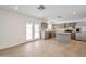 Modern kitchen with gray cabinets, island, and stainless steel appliances, overlooking the pool at 6249 S Parkside Dr, Tempe, AZ 85283