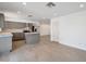 Open concept kitchen with gray cabinets, stainless steel appliances, and an island at 6249 S Parkside Dr, Tempe, AZ 85283