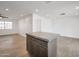 Open kitchen with gray cabinetry, a large island, and stainless steel appliances at 6249 S Parkside Dr, Tempe, AZ 85283