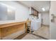 Laundry room with washer, dryer, and workbench at 6249 S Parkside Dr, Tempe, AZ 85283