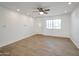 Bright living room with wood-look tile flooring and ceiling fan at 6249 S Parkside Dr, Tempe, AZ 85283