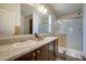 Bathroom boasts double sinks, a large mirror, and a walk-in shower at 6722 W Taylor St # 294, Phoenix, AZ 85043