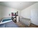 Bright bedroom with twin beds, ample closet space, and neutral decor at 6722 W Taylor St # 294, Phoenix, AZ 85043