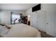 Spacious Primary bedroom with king-size bed and ensuite bathroom access at 6722 W Taylor St # 294, Phoenix, AZ 85043
