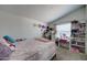 Spacious bedroom with queen bed and built-in shelving at 6722 W Taylor St # 294, Phoenix, AZ 85043