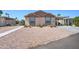 Tan two-bedroom house with carport and landscaped yard at 6722 W Taylor St # 294, Phoenix, AZ 85043