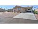 Tan two-bedroom house with carport and parked truck at 6722 W Taylor St # 294, Phoenix, AZ 85043