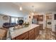 Open concept kitchen with island and laundry area visible at 6722 W Taylor St # 294, Phoenix, AZ 85043